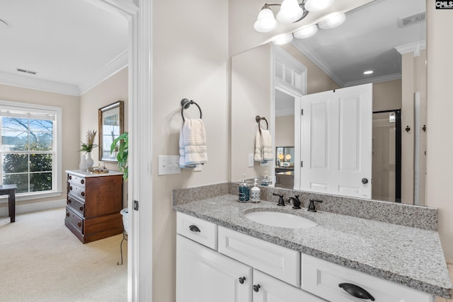 bathroom featuring ornamental molding and vanity