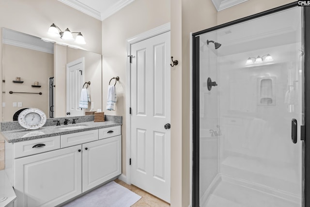 bathroom featuring an enclosed shower, vanity, ornamental molding, and tile patterned flooring