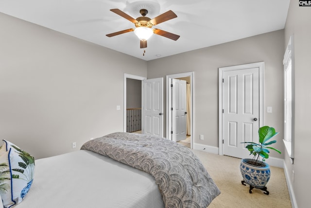 carpeted bedroom featuring ceiling fan