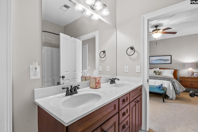 bathroom with ceiling fan and vanity