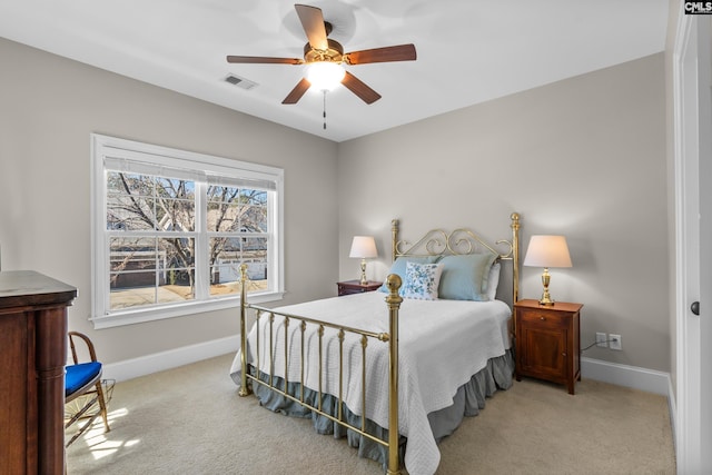 bedroom featuring ceiling fan and light colored carpet