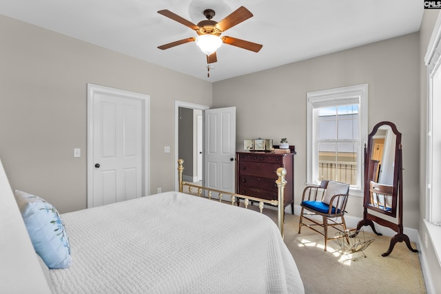 bedroom featuring a closet, ceiling fan, and carpet