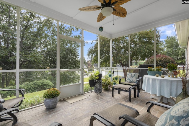 sunroom featuring ceiling fan