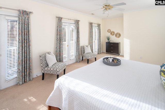 carpeted bedroom with ceiling fan, crown molding, access to outside, and multiple windows