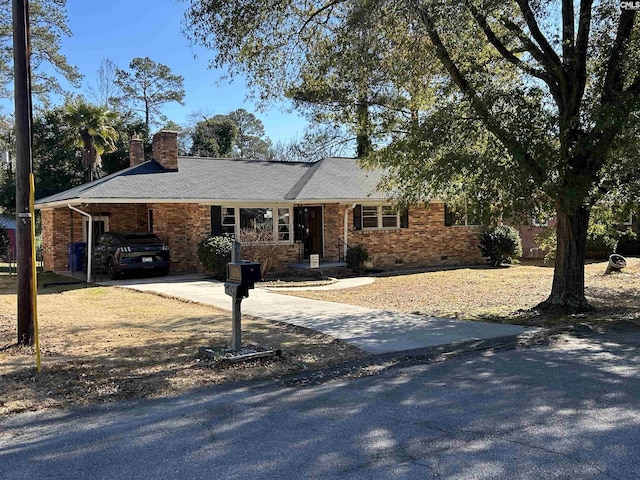 ranch-style house with a carport