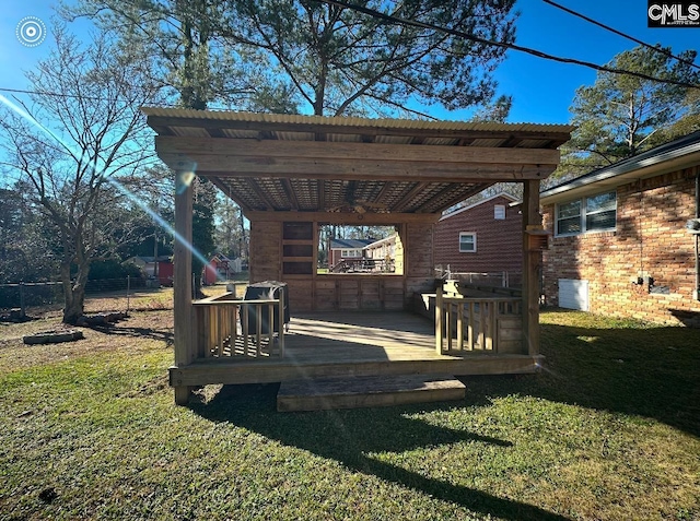 view of yard featuring a deck and a pergola