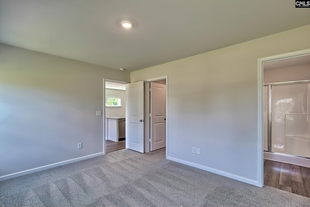 unfurnished bedroom with light carpet