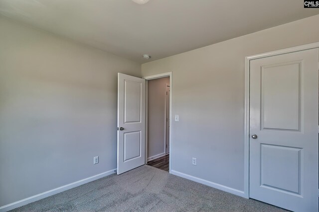 unfurnished bedroom with carpet flooring