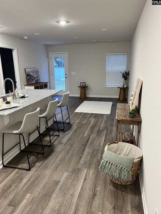 dining space with dark wood-type flooring