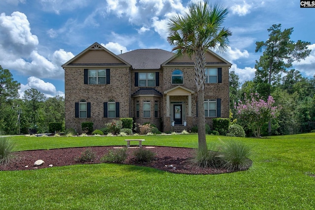 craftsman-style home featuring a front lawn