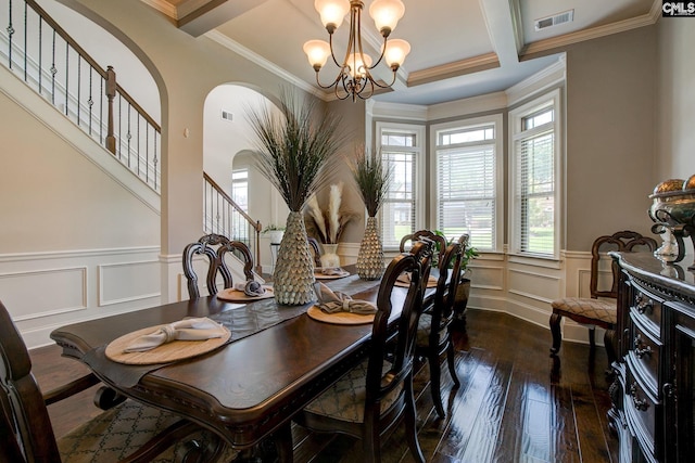 dining space with beamed ceiling, dark hardwood / wood-style flooring, crown molding, and a chandelier