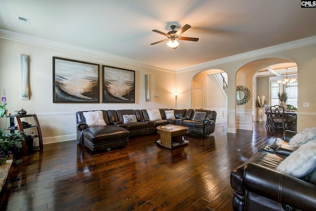 living room with ceiling fan, crown molding, and dark wood-type flooring