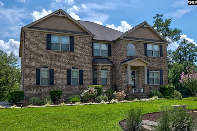 craftsman inspired home with a front yard