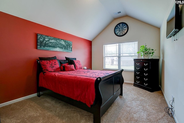 carpeted bedroom with vaulted ceiling