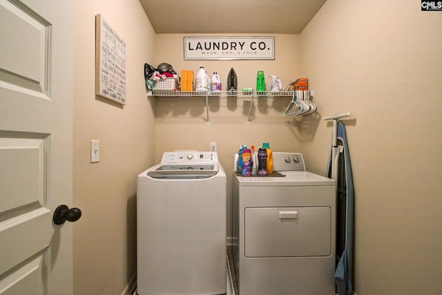 washroom with separate washer and dryer