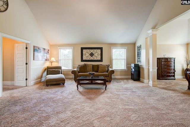 living room featuring high vaulted ceiling, carpet, and ornate columns