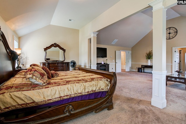 carpeted bedroom featuring vaulted ceiling and ornate columns