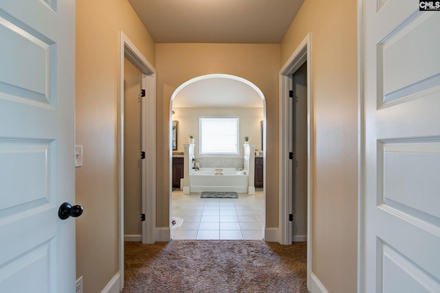 hall with light carpet