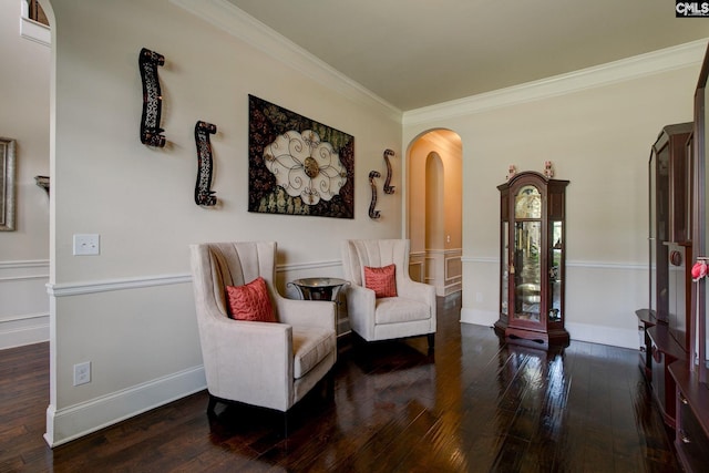 sitting room featuring dark hardwood / wood-style floors and ornamental molding