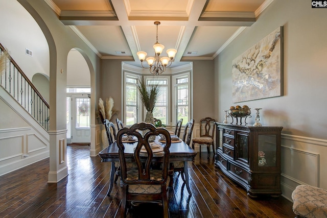 dining area featuring crown molding, coffered ceiling, a healthy amount of sunlight, and beam ceiling