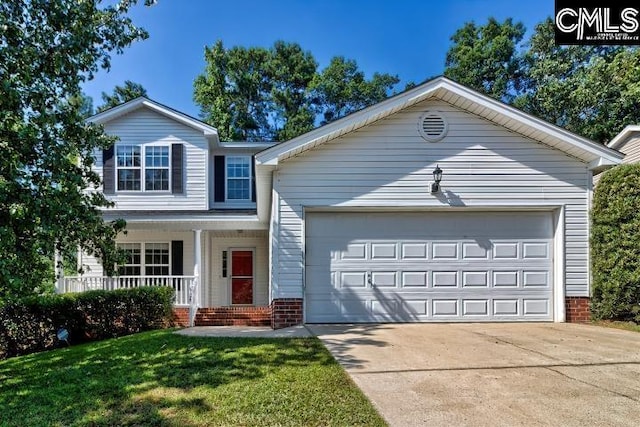 view of front facade with a porch, a garage, and a front lawn