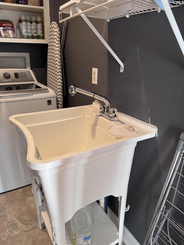 laundry room featuring sink and washer / clothes dryer