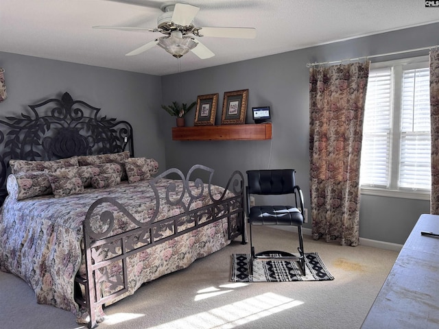 bedroom with carpet, multiple windows, and ceiling fan