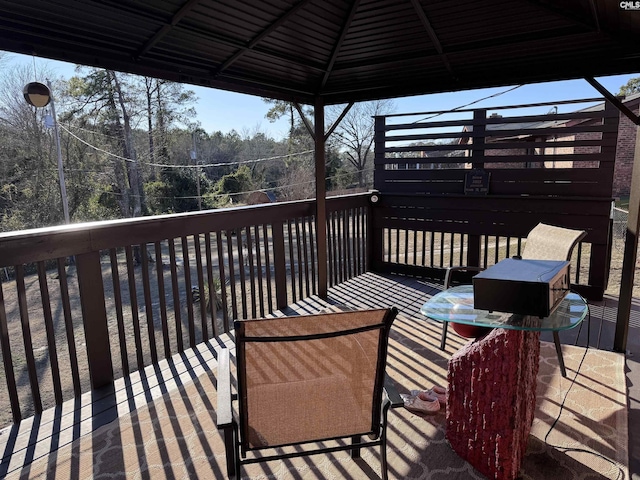 wooden terrace with a gazebo