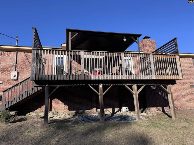 back of property featuring a wooden deck