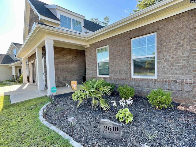 entrance to property with a patio