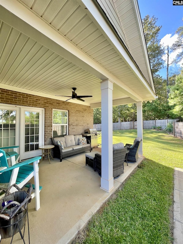 view of patio with an outdoor living space, ceiling fan, and area for grilling