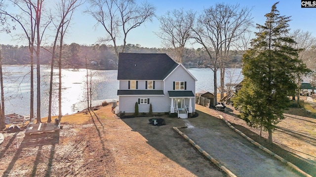 view of front of house with a water view