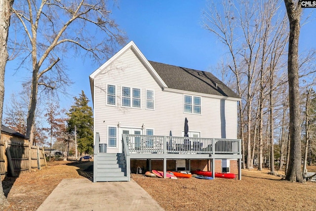 rear view of property with a deck