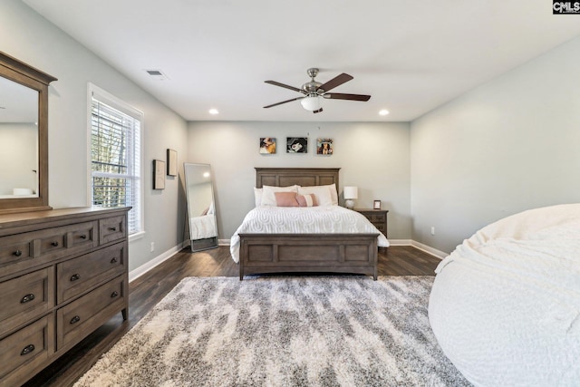 bedroom with ceiling fan and dark hardwood / wood-style floors