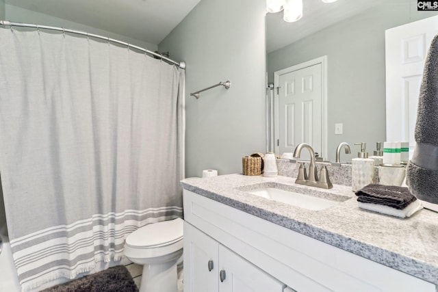 bathroom featuring toilet and vanity