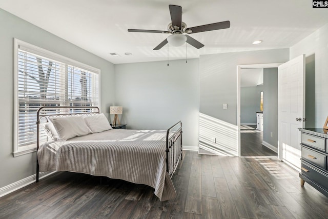 bedroom featuring ceiling fan and dark hardwood / wood-style floors