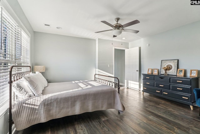 bedroom with ceiling fan and dark hardwood / wood-style floors