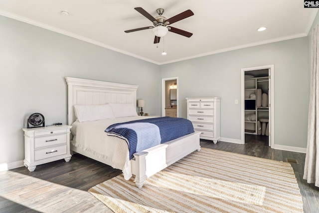 bedroom featuring a walk in closet, ceiling fan, dark hardwood / wood-style flooring, and a closet