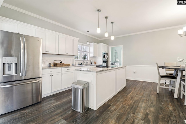 kitchen featuring hanging light fixtures, white cabinets, stainless steel fridge with ice dispenser, and a center island