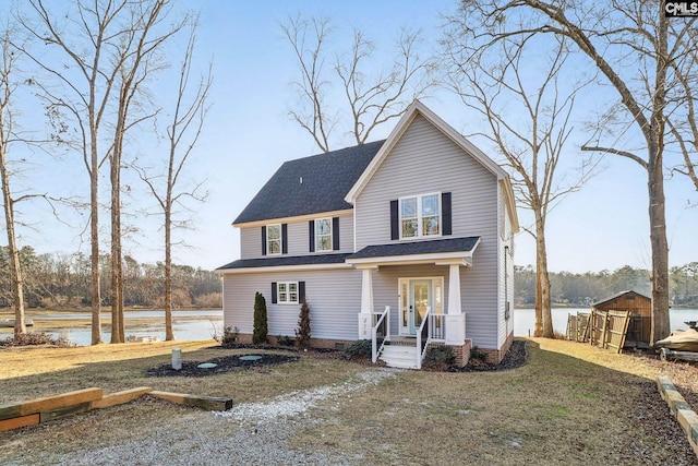 view of front property with a water view