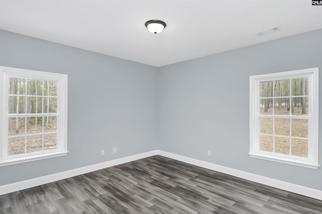 unfurnished room featuring dark hardwood / wood-style floors