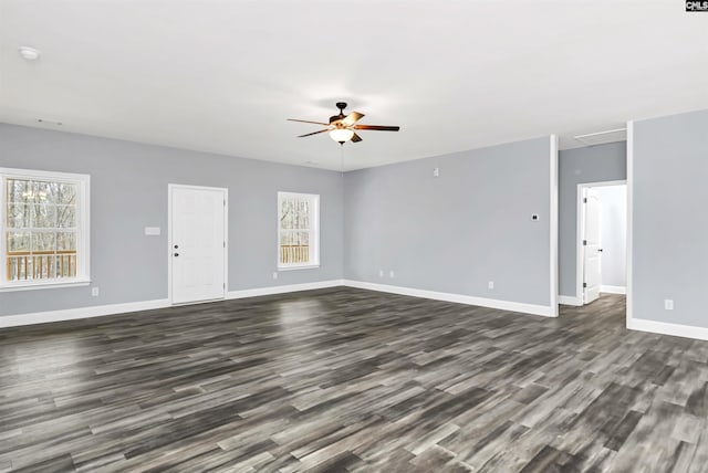 unfurnished living room featuring dark hardwood / wood-style floors and ceiling fan