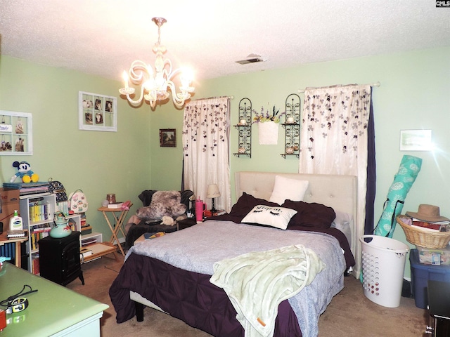 carpeted bedroom featuring a textured ceiling and an inviting chandelier