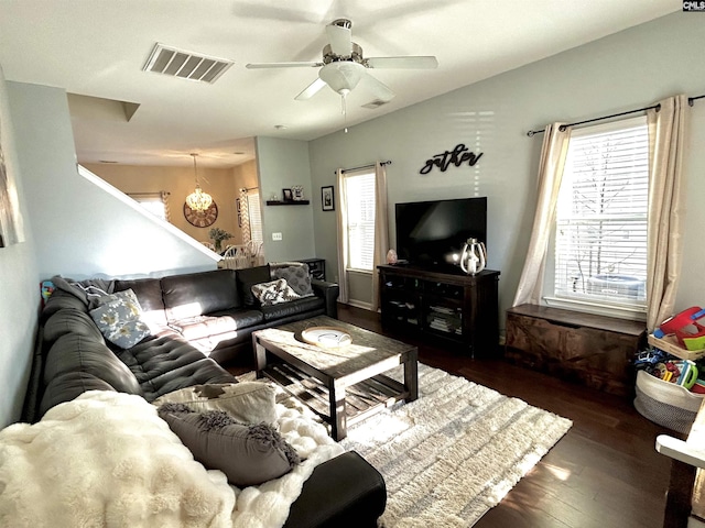 living room with dark wood-type flooring and ceiling fan