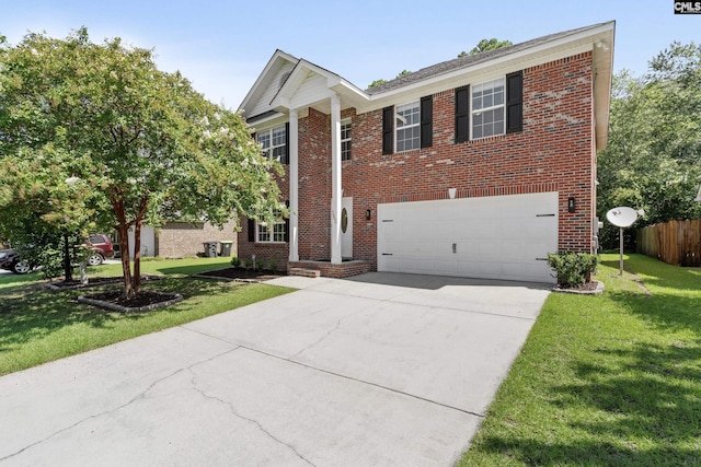 view of front of home with a garage and a front yard