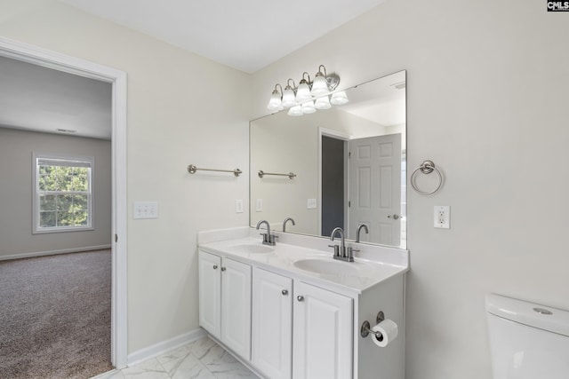 bathroom with vanity and toilet