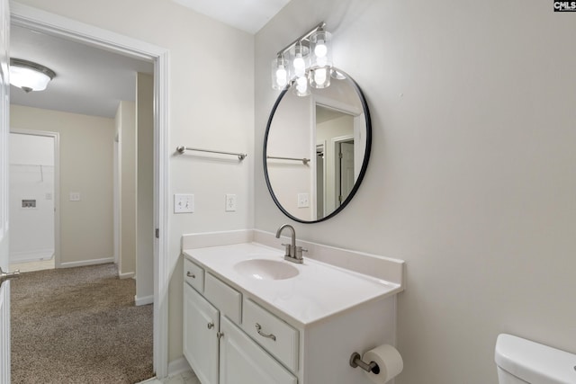 bathroom with vanity and toilet