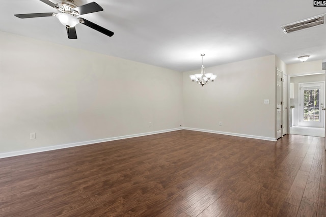 unfurnished room with dark wood-type flooring and ceiling fan with notable chandelier