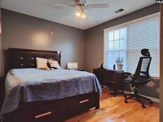 bedroom featuring ceiling fan and light hardwood / wood-style flooring