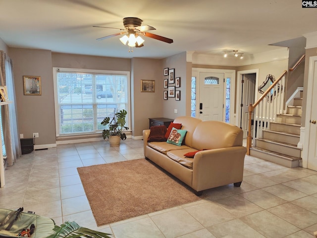 living room featuring light tile patterned flooring and ceiling fan